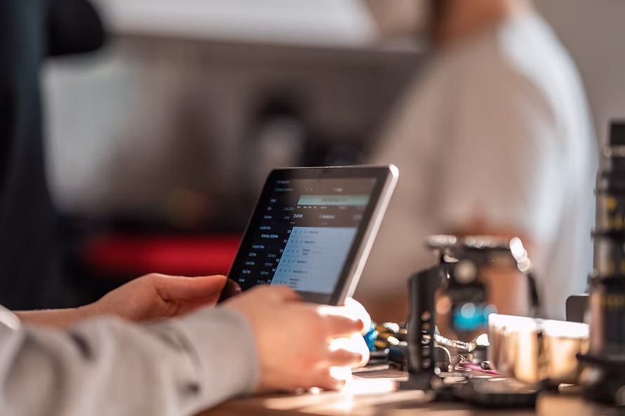 Professional using a tablet for Veeva Vault PromoMats digital content management and workflow collaboration